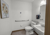 Resident's private, handicapped-accessible restroom with toilet and sink.