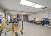 Spacious room with gym and physical therapy equipment
